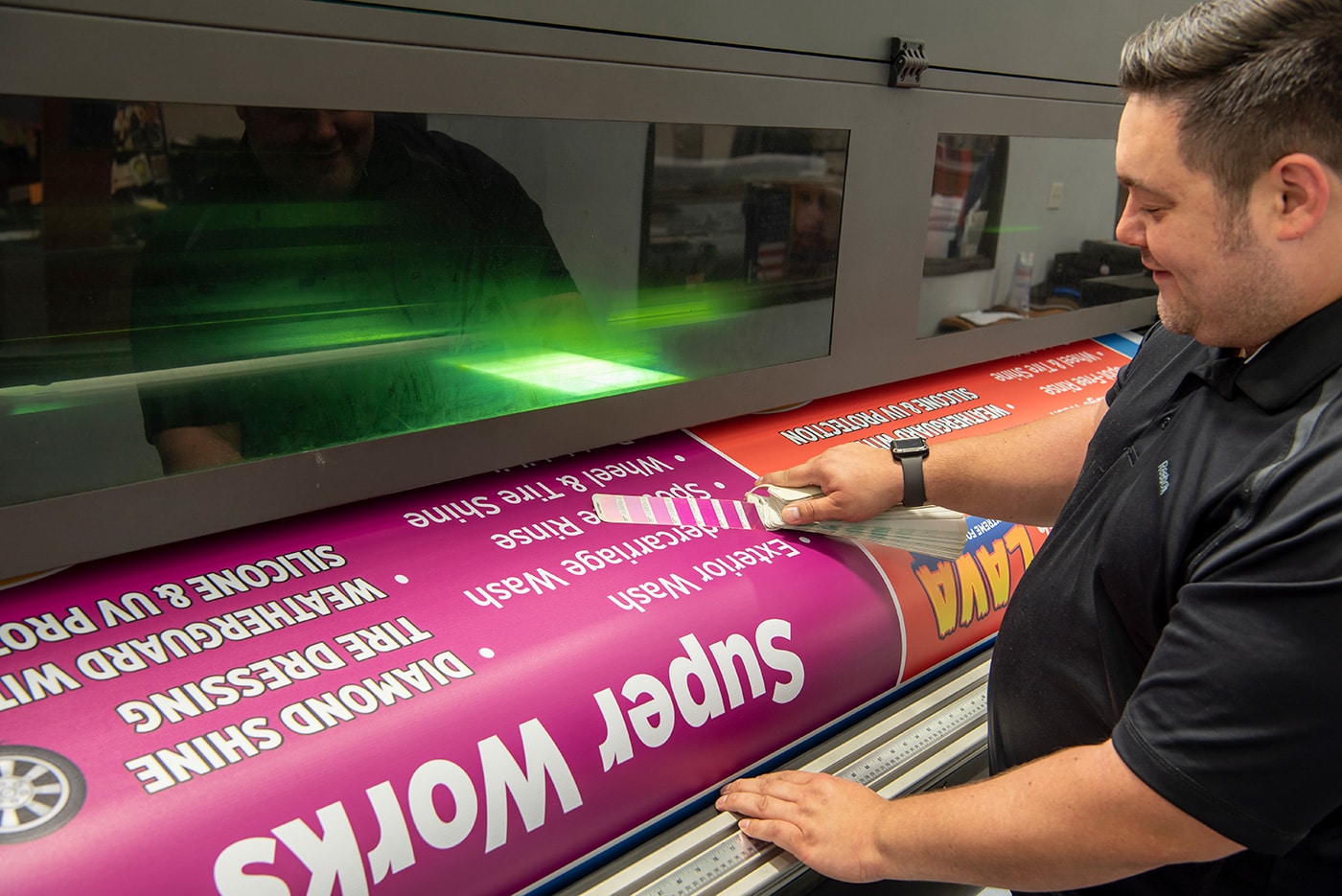 Image of worker using large format printer